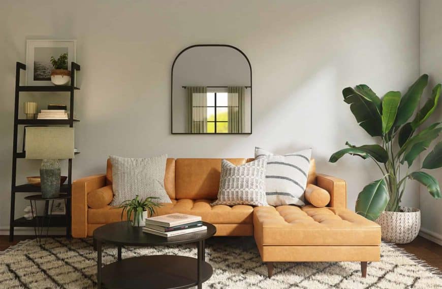 A living room with a mirror and orange couch